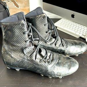 Black men’s Under Armor high top football cleats